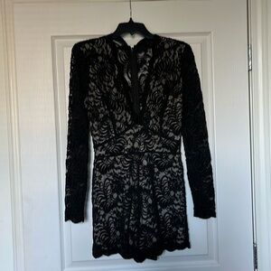Romantic Black Lace Romper! A “WOW” will surely follow once the coat comes off.